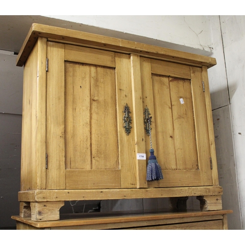 1799 - Small 19th Century stripped and polished pine side cabinet, the plank top above a single drawer and ... 