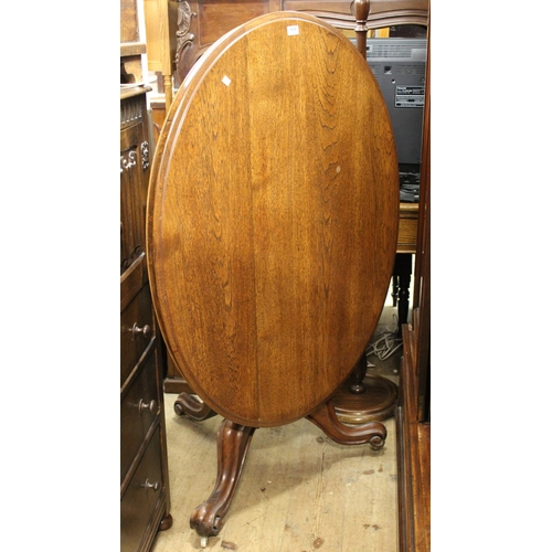 1818 - Victorian oval oak tilt top loo table on turned column and tripod support