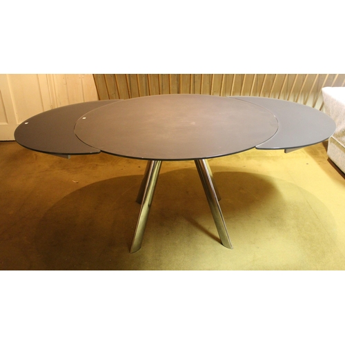 1834A - Modern circular black glass and chrome dining table, 120cm diameter, together with a set of six velo... 