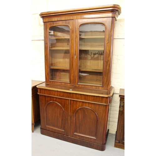 1837 - Good quality mahogany bookcase, the moulded cornice above two arched glazed doors, the base with a s... 