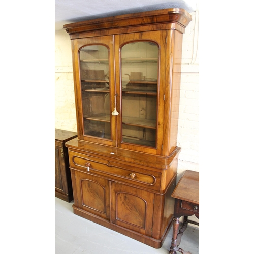 1838 - Good quality Victorian walnut bookcase, the moulded cornice above two arched glazed doors, the base ... 