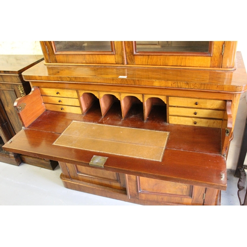 1838 - Good quality Victorian walnut bookcase, the moulded cornice above two arched glazed doors, the base ... 