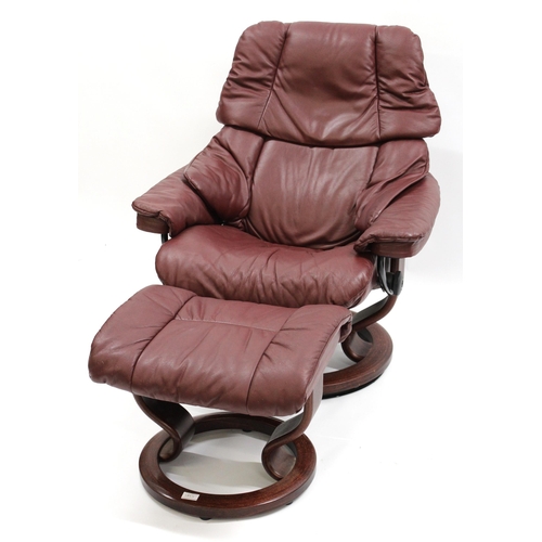 1855 - Stressless pair of burgundy leather upholstered tub chairs with foot stools