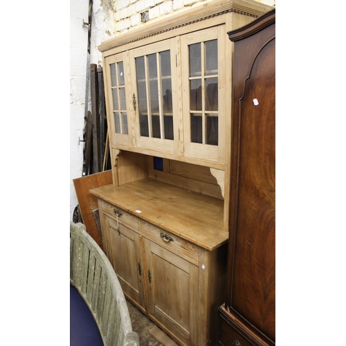 1872 - 19th Century stripped pine side cabinet with three glazed doors, above two drawers and two panelled ... 