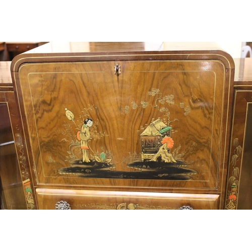 1886 - Walnut Odeon style display cabinet with raised chinoiserie decoration, the fall front over two cupbo... 