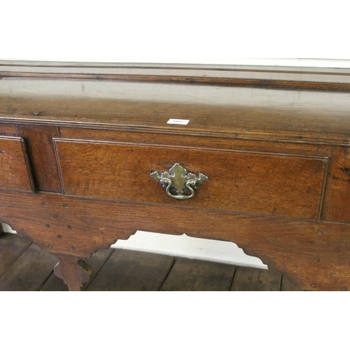 1892 - George III oak dresser, the open shelf back above three drawers and a three bay base with pot shelf,... 