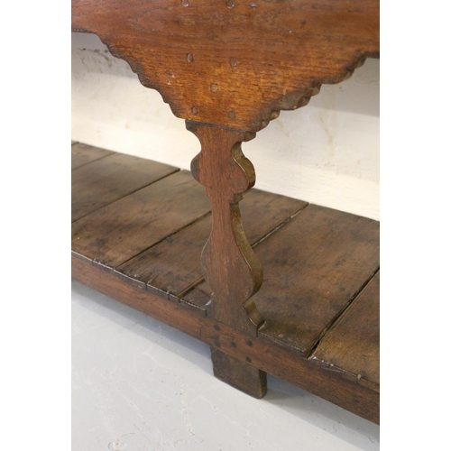 1892 - George III oak dresser, the open shelf back above three drawers and a three bay base with pot shelf,... 