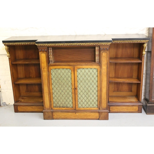 1893 - 19th Century mahogany and satin birch breakfront bookcase, the black slate top above an acanthus par... 