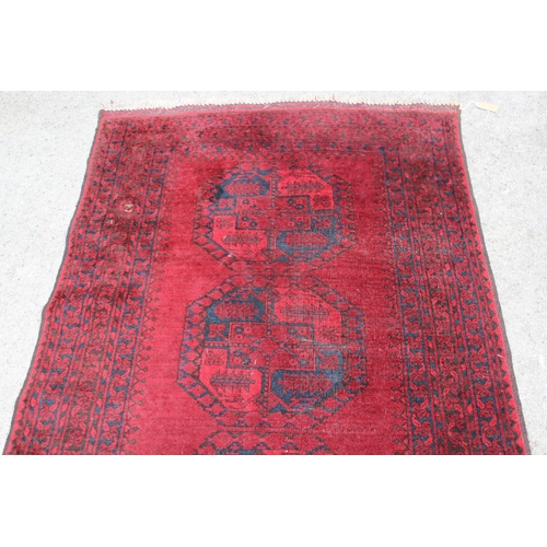 19 - Afghan rug of four central medallions and multiple borders, 226 x 115cm