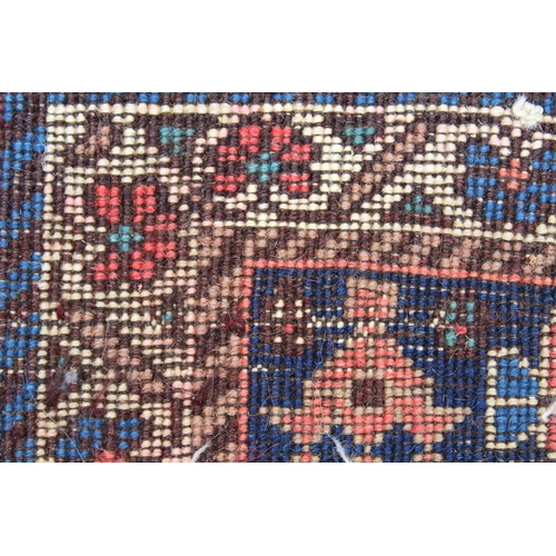 27 - Small Kurdish runner with a linked hooked medallion design on a rose ground with borders, 192 x 65cm