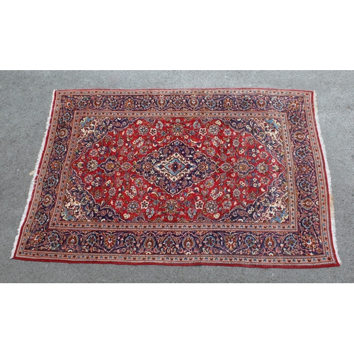 3 - Modern Kashan carpet with all-over floral decoration on a red ground with multiple borders