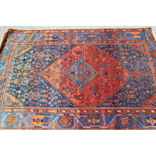 30 - Hamadan rug with a medallion and all-over stylised design in shades of red, blue and orange, 204 x 1... 