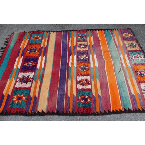 32 - Flatweave rug with bands of thick piled decoration in a polychrome design, 237 x 160cm