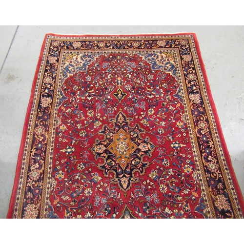 4 - Modern Kashan rug, with all-over floral design on red ground with borders