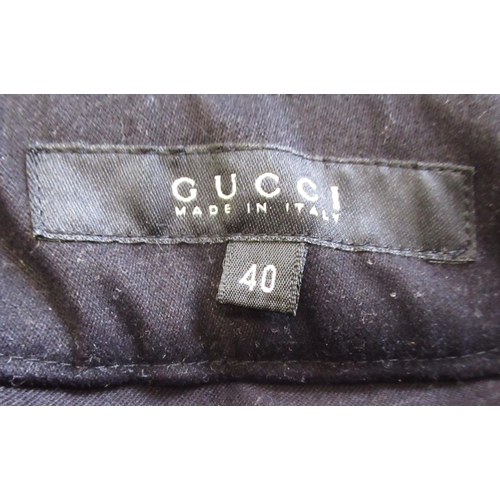 47 - Gucci, pair of ladies trousers, size 40, together with a Temperly of London, Romaine dress, size 14,... 