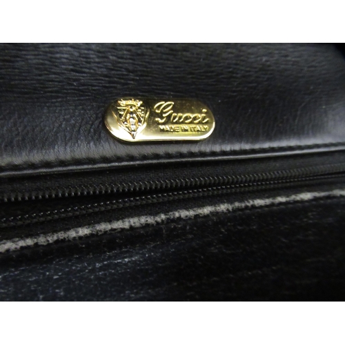 63 - Gucci, crossbody leather and cloth bag, with dust cover, another Gucci handbag (at fault), ladies Gu... 