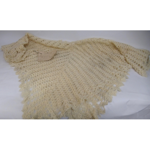 68 - Woollen shawl labelled Marlborough House SW1, inscribed ' Worked by Her Majesty Queen Mary '