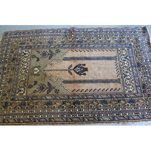 8 - Turkish prayer rug with central mihrab with multiple borders in muted colours, 195 x 117cm