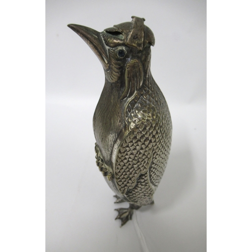 82 - Unusual silver plated German figure of a penguin holding a rifle with jewel inset eyes, circa 1900, ... 