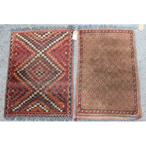 9 - Two small Afghan rugs on red ground, 62 x 45cm