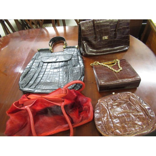 45 - Group of three leather handbags, together with a red dyed fur and leather bag and another smaller cl... 