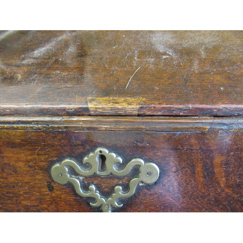 1910 - George III oak bureau, the fall front above an unusual arrangement of short and long drawers on brac... 