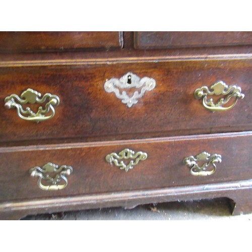 1910 - George III oak bureau, the fall front above an unusual arrangement of short and long drawers on brac... 