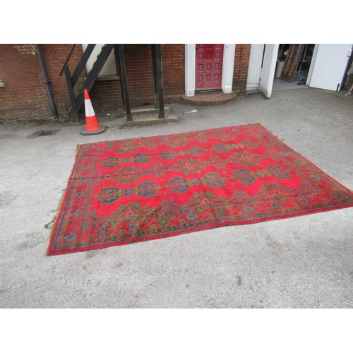 16 - Large Turkish carpet with Ushak design on a red ground with borders, 4m x 3m