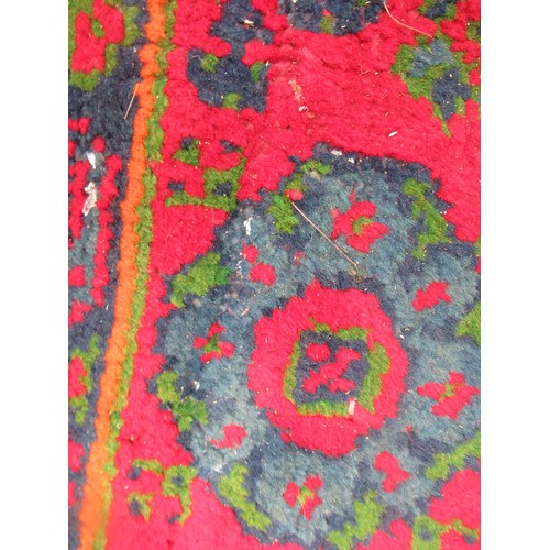 16 - Large Turkish carpet with Ushak design on a red ground with borders, 4m x 3m