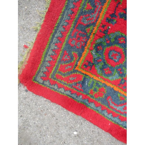 16 - Large Turkish carpet with Ushak design on a red ground with borders, 4m x 3m