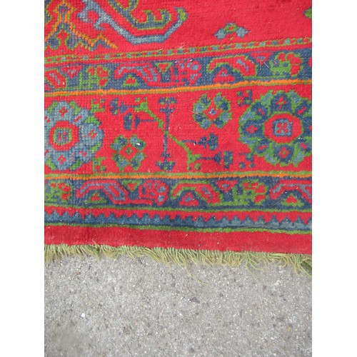 16 - Large Turkish carpet with Ushak design on a red ground with borders, 4m x 3m