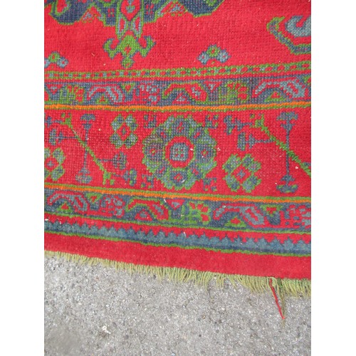 16 - Large Turkish carpet with Ushak design on a red ground with borders, 4m x 3m