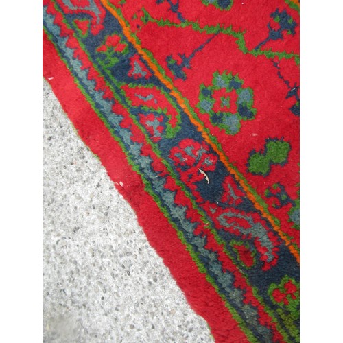 16 - Large Turkish carpet with Ushak design on a red ground with borders, 4m x 3m