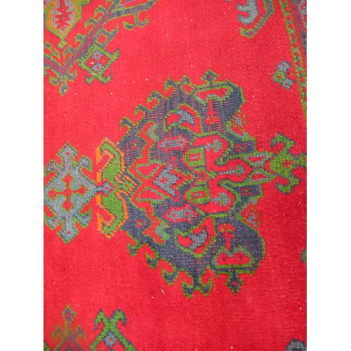 16 - Large Turkish carpet with Ushak design on a red ground with borders, 4m x 3m