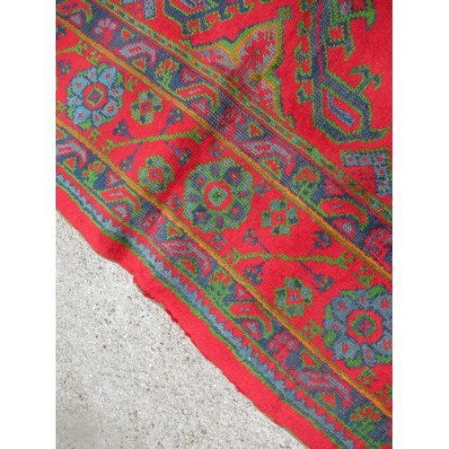 16 - Large Turkish carpet with Ushak design on a red ground with borders, 4m x 3m