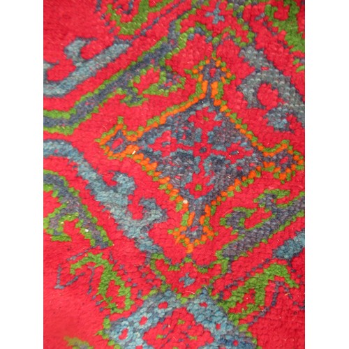 16 - Large Turkish carpet with Ushak design on a red ground with borders, 4m x 3m