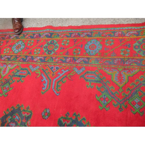 16 - Large Turkish carpet with Ushak design on a red ground with borders, 4m x 3m