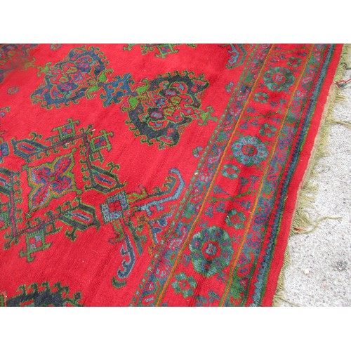 16 - Large Turkish carpet with Ushak design on a red ground with borders, 4m x 3m