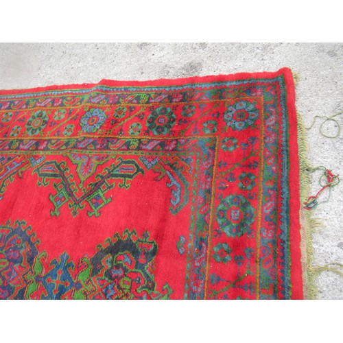 16 - Large Turkish carpet with Ushak design on a red ground with borders, 4m x 3m