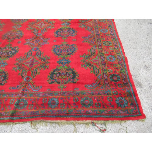 16 - Large Turkish carpet with Ushak design on a red ground with borders, 4m x 3m