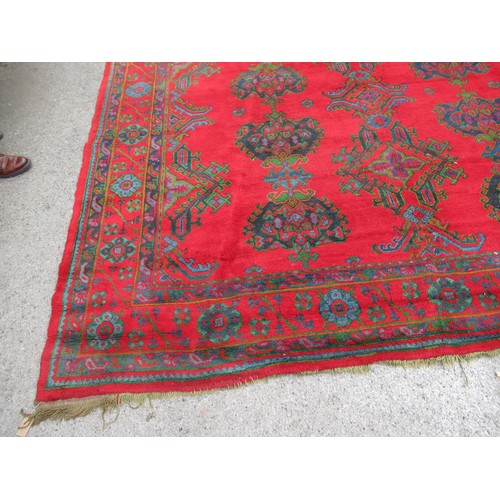 16 - Large Turkish carpet with Ushak design on a red ground with borders, 4m x 3m