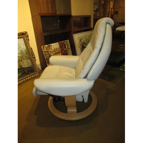 1830 - Modern Stressless cream leather upholstered swivel armchair, together with a matching footstool