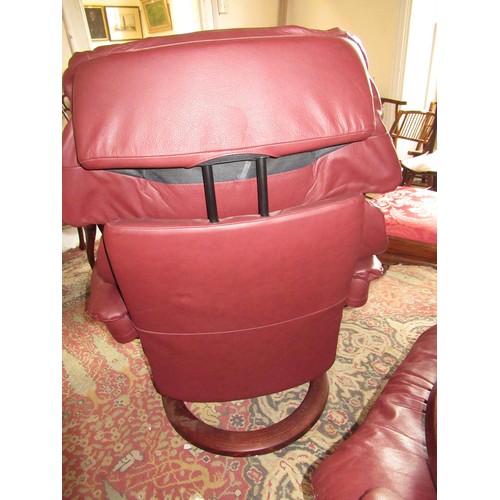 1855 - Stressless pair of burgundy leather upholstered tub chairs with foot stools