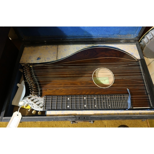 121 - German concert zither by Arcus, in a fitted case, together with another by Hug & Co., Basel, in orig... 