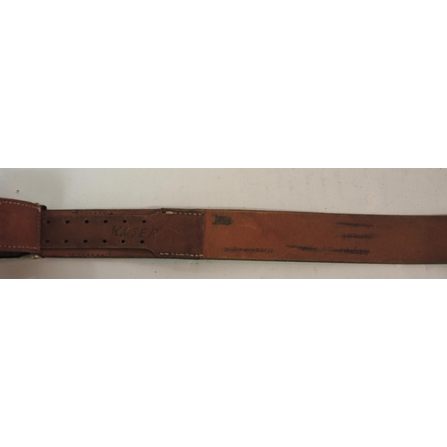 129 - East German leather belt with metal buckle, together with a German cloth field cap