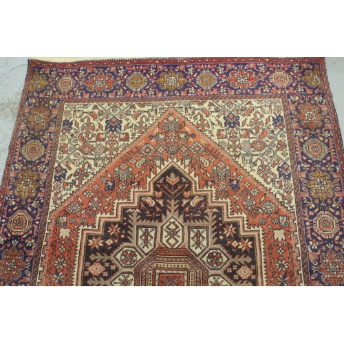 13 - Modern Gholtogh type rug with a medallion and all-over stylised design with corner designs and borde... 