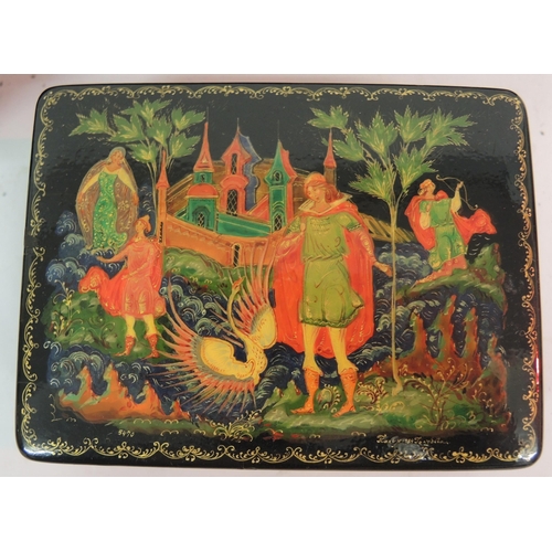 135 - Group of four various Russian lacquer papier mache boxes decorated with mythological scenes , the la... 