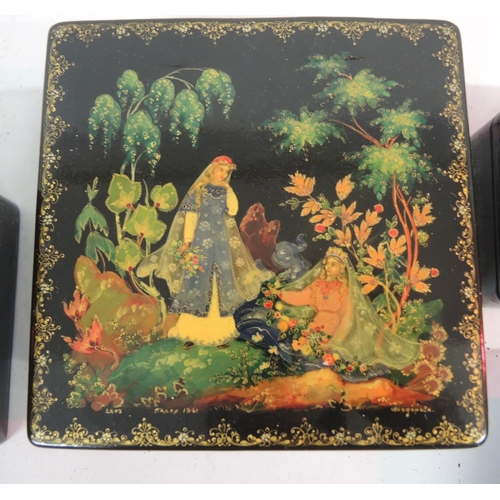 135 - Group of four various Russian lacquer papier mache boxes decorated with mythological scenes , the la... 