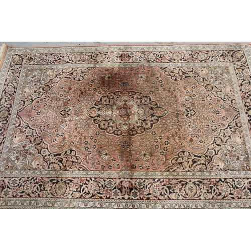 14 - Indian cotton rug with a medallion and all-over floral design on a rose ground with borders, 188 x 1... 