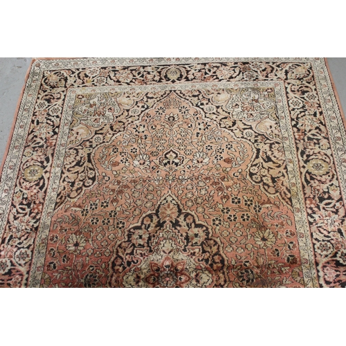 14 - Indian cotton rug with a medallion and all-over floral design on a rose ground with borders, 188 x 1... 